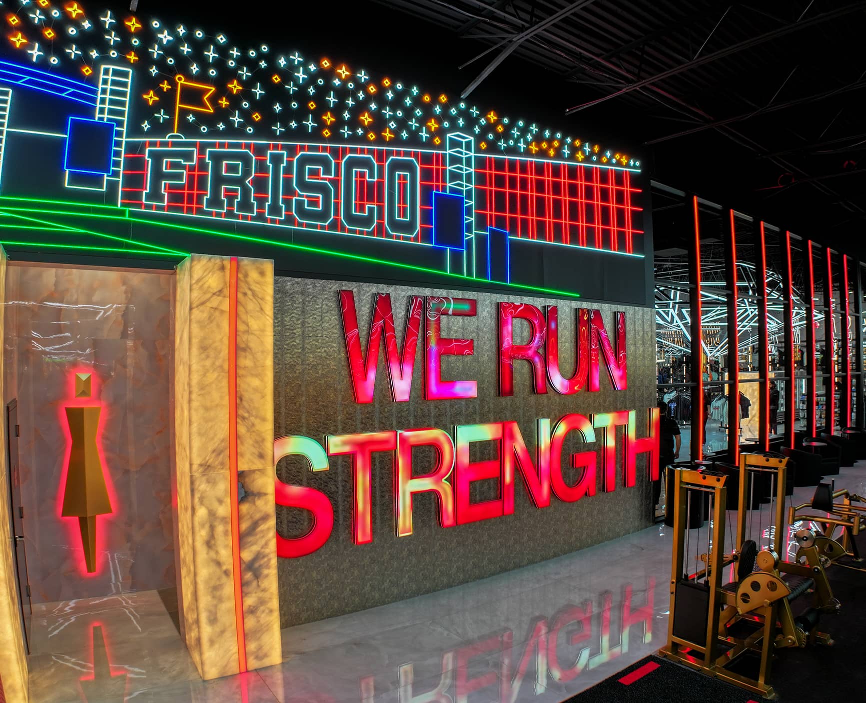 Absolute Recomp Frisco wall graphic with Frisco skyline and We Run Strength sign