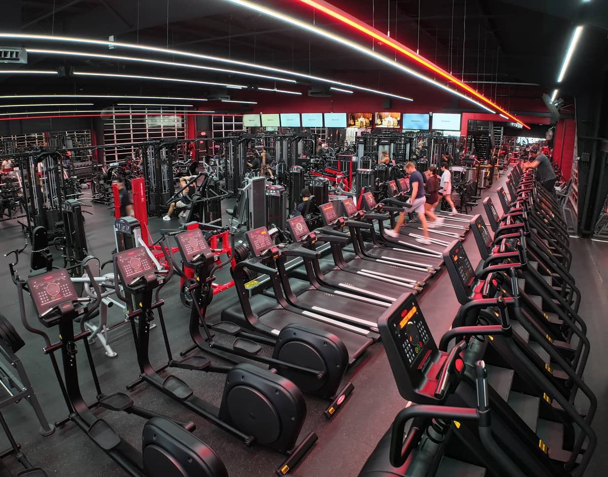 Cardio floor at Absolute Recomp North Richland Hills with treadmills and ellipticals