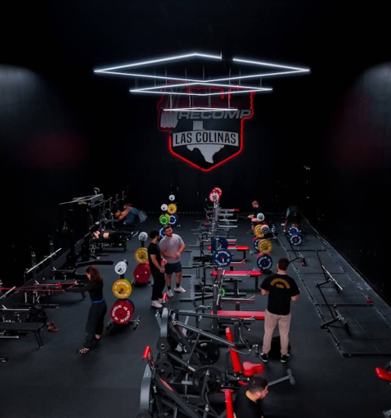 Absolute Recomp Las Colinas gym interior with strength equipment floor